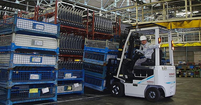 Nissan forklift operating in industrial warehouse