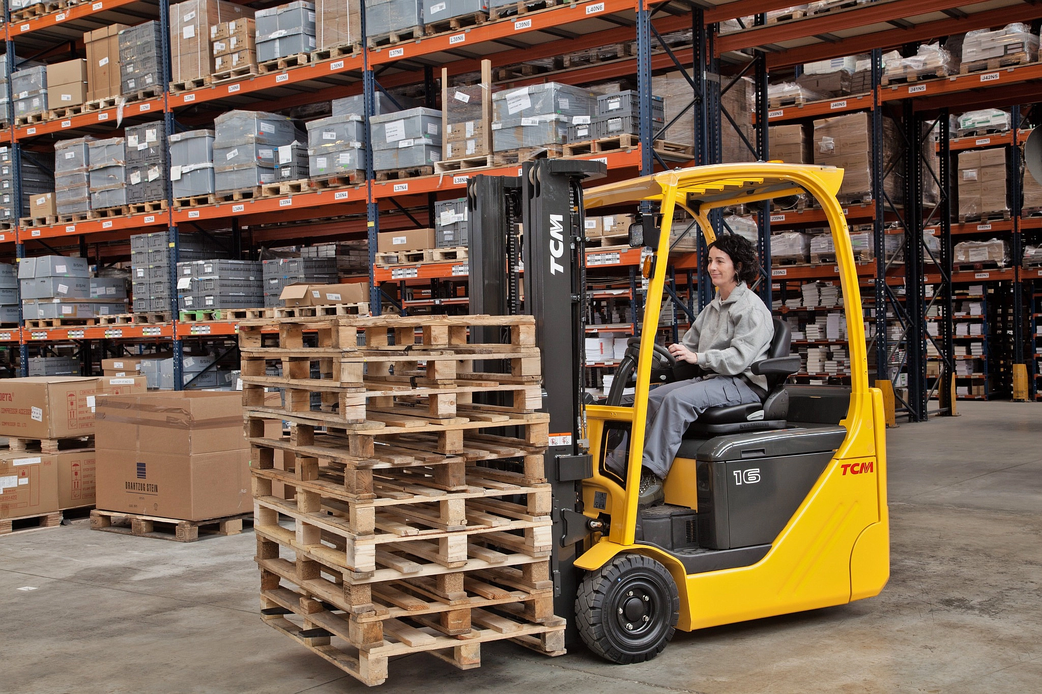 TCM electric forklift operating in warehouse